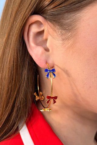 Miss Americana Hoop Earrings featuring delicate bow details on 18K gold-plated brass and steel hoops, measuring 2.25 inches—elegant, playful jewelry for any occasion.