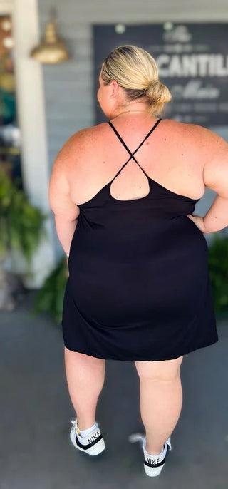 Woman wearing the Backless and Breezy Dress, styled casually for a chic, free-spirited look