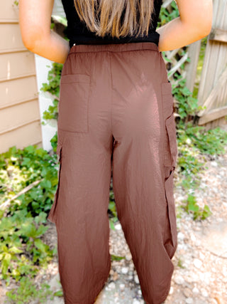 Archer Asymmetrical Pocket Wide Leg Cargos displayed flat, showcasing the unique pocket design and relaxed fit.