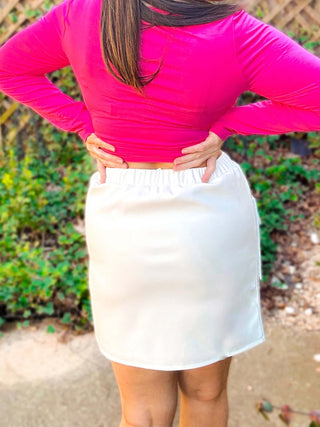 Close-up view of the cargo details and vegan leather texture of the Campbell Cargo Vegan Leather Mini Skirt