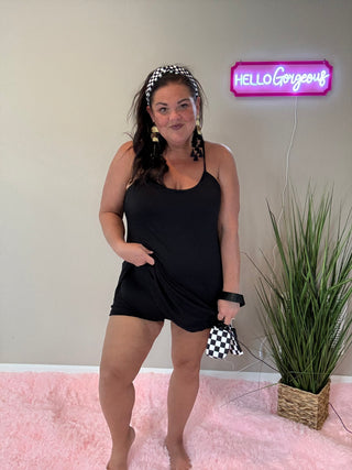 Woman wearing the Backless and Breezy Dress, styled casually for a chic, free-spirited look