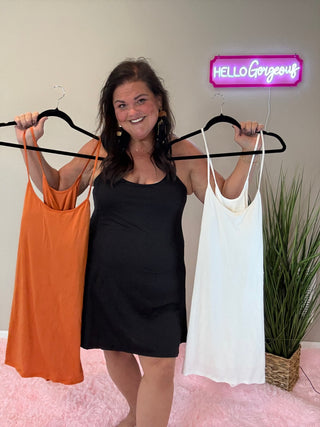 Woman wearing the Backless and Breezy Dress, styled casually for a chic, free-spirited look