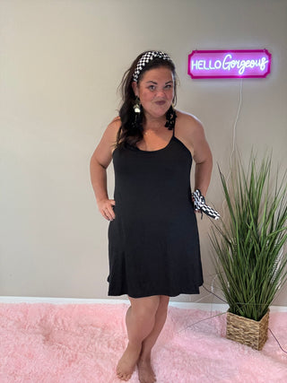 Woman wearing the Backless and Breezy Dress, styled casually for a chic, free-spirited look