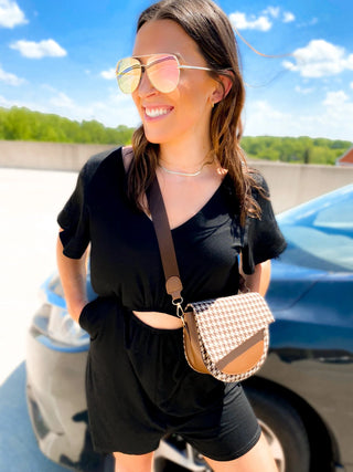 Woman wearing the Ryan Reversible Cutout Jumper, styled casually for a chic, versatile look.