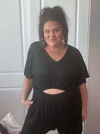 Woman wearing the Ryan Reversible Cutout Jumper, styled casually for a chic, versatile look.