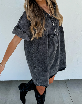 Woman wearing the Last Dance Denim Dress, styled with heels for a chic and feminine look.