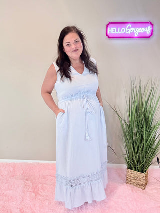 Model wearing Lace Cutout Dress in soft sky blue featuring delicate lace accents and a ruffled collar.