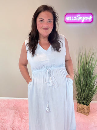 Front view of romantic sky blue dress with cutout lace details and drawstring neckline.