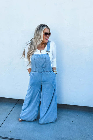 Woman wearing the Boho Jean Overalls, styled casually for a playful, boho-chic look.