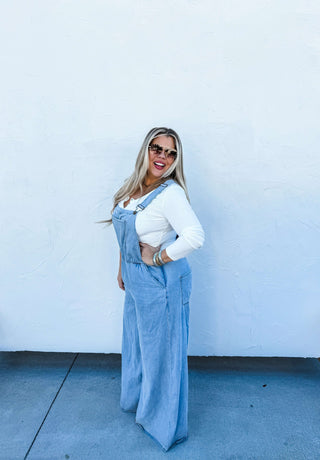 Woman wearing the Boho Jean Overalls, styled casually for a playful, boho-chic look.
