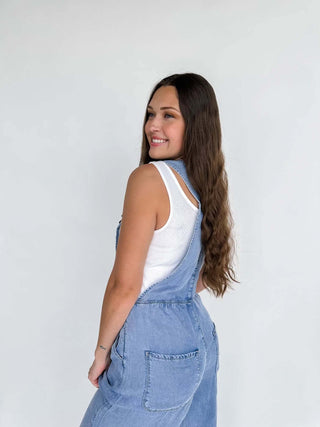 Close-up view of the denim fabric and boho design details of the Boho Jean Overalls.