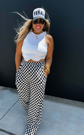 Woman wearing the Bold Block Checker Pants, styled casually with a top for a bold, trendy look.