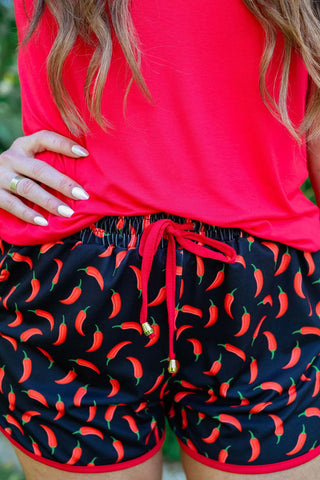 Close-up view of the vibrant print and drawstring waistband of the Bring The Heat Drawstring Everyday Shorts.