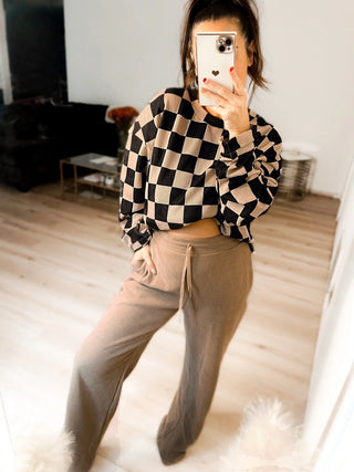 Woman wearing the Charlie Checkered Corded Set styled casually for a chic, comfortable look.