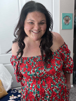 Woman wearing the Sabrina Smocked Bell Sleeve Dress, styled for a chic and feminine look perfect for casual outings or special occasions.