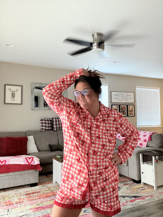 Cuter Than Cupid Ruffle Pajama Set styled in a cozy bedroom for a playful, comfy bedtime look.