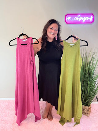 Model wearing Asymmetric Hem Dani Tank Dress with raw edge details and breezy, relaxed fit, showing all 3 colors: pink, black, and green.