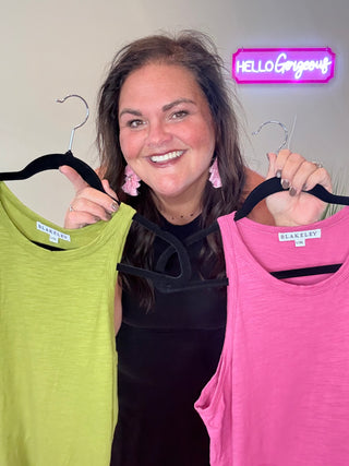 Model wearing Asymmetric Hem Dani Tank Dress with raw edge details and breezy, relaxed fit, showing all 3 colors: pink, black, and green.