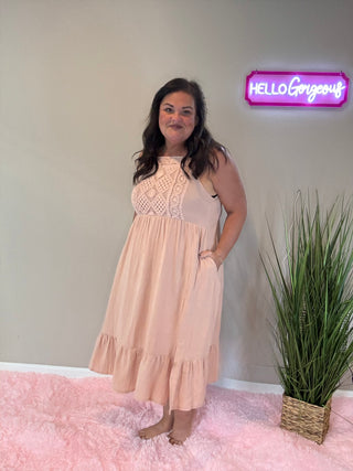 Front view of crochet dress in dusty rose with lightweight cotton fabric and relaxed, romantic silhouette.