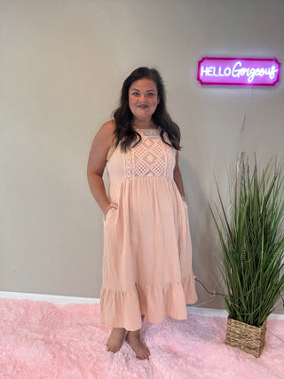 Front view of crochet dress in dusty rose with lightweight cotton fabric and relaxed, romantic silhouette.