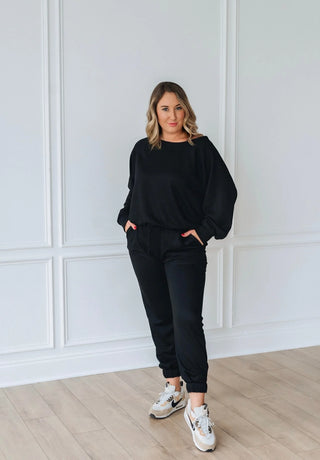 Woman wearing the Essential Jogger Set, styled casually for a comfy, chic look.