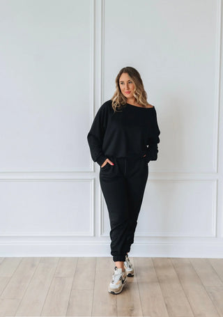 Woman wearing the Essential Jogger Set, styled casually for a comfy, chic look.