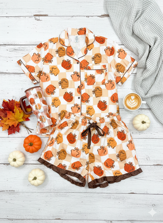 Featuring a cheerful mix of checkered and pumpkin prints, this set is the perfect way to celebrate the season in comfort and style.