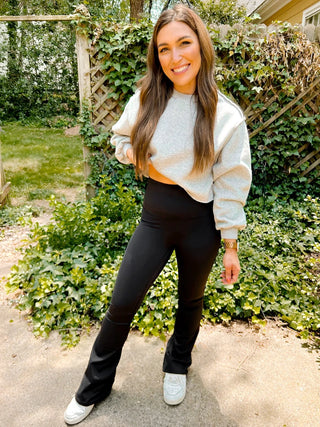 Woman wearing the Fallon Flare Suck and Tuck Leggings, styled casually for a flattering, chic look."