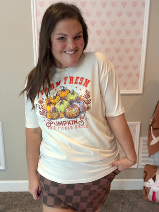Natural-colored “Farm Fresh Pumpkins” tee with hand-placed crystals, paired with a brown skort for a cozy fall look; soft cotton fabric and sparkling detail make it perfect for pumpkin patch days and crisp autumn outings.