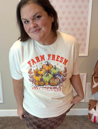 Natural-colored “Farm Fresh Pumpkins” tee with hand-placed crystals, paired with a brown skort for a cozy fall look; soft cotton fabric and sparkling detail make it perfect for pumpkin patch days and crisp autumn outings.
