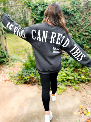 Woman wearing the ‘If You Can Read This’ Spring Scuba Sweatshirt, styled casually for a playful and relaxed look.