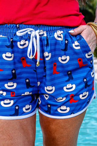 Close-up view of the drawstring waistband and western graphic design of the Hey There Cowboy Drawstring Everyday Shorts.