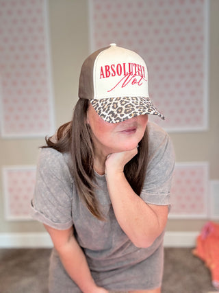 Person wearing a cap with 'Absolutely Not' text in a casual setting