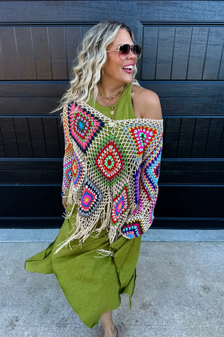 Model wearing Asymmetric Hem Dani Tank Dress with raw edge details and breezy, relaxed fit in green.