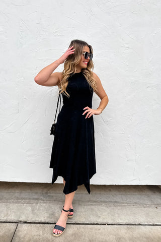 Front view of tank dress featuring an asymmetric hemline and soft slub cotton fabric in black.