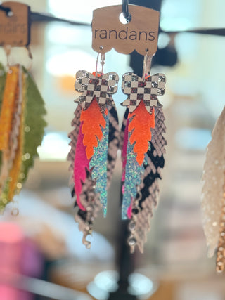 Checkered and neon feathers with accents of snake print, multi layered earring.
