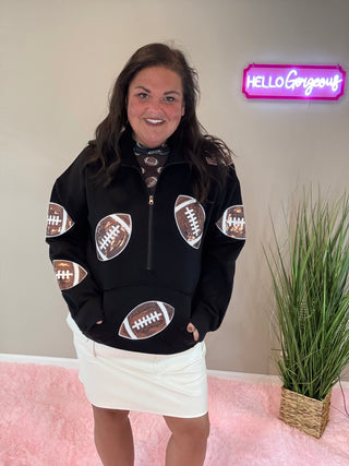 Woman wearing the Kick Offer Quarter Zip Pullover, styled casually with jeans for a chic, comfortable look.