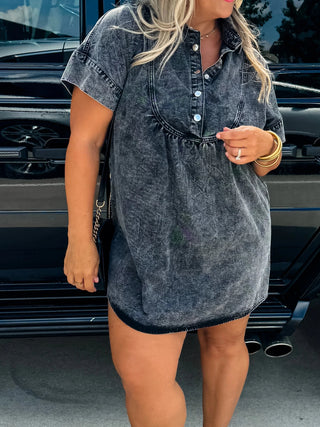 Woman wearing the Last Dance Denim Dress, styled with heels for a chic and feminine look.