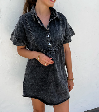 Woman wearing the Last Dance Denim Dress, styled with heels for a chic and feminine look.