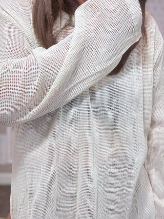 Lightweight cotton mesh top with slouchy oversized fit, tunic length, wide boatneck, and side slits — breathable, airy, and perfect for layering.