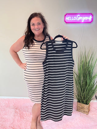 Front view of chic ribbed dress with body-hugging silhouette and subtle, stylish stripes.