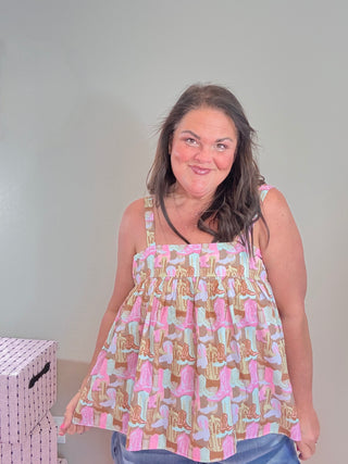 Flowy Boot Print Sleeveless Top – Rodeo Ruffle Sleeveless Top featuring a fun boot pattern and a comfortable, relaxed fit.