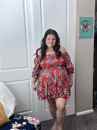 Woman wearing the Sabrina Smocked Bell Sleeve Dress, styled for a chic and feminine look perfect for casual outings or special occasions.