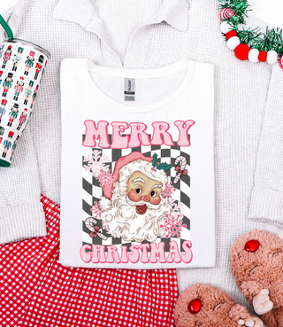 Christmas-themed t-shirt with Santa Claus design and 'Merry Christmas' text, surrounded by festive items.