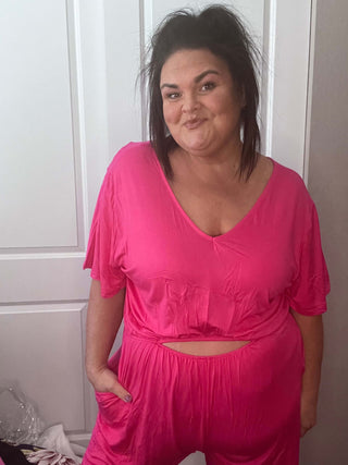 Woman wearing the Ryan Reversible Cutout Jumper, styled casually for a chic, versatile look.