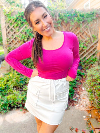 Close-up view of the cargo details and vegan leather texture of the Campbell Cargo Vegan Leather Mini Skirt