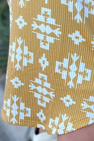 Close-up of the delicate daisy print on soft, breezy fabric of the Wild Daisy Dress.