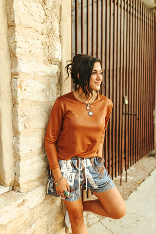 Soft sweatshirt-style lounge shorts with raw hem, stretch waistband, and pockets. Neutral colorway with a comfy, relaxed fit.