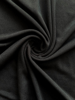 Close-up view of the ribbed fabric and bodycon fit of the Bridgette Bodycon Ribbed Dress.