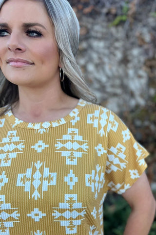 Close-up of the delicate daisy print on soft, breezy fabric of the Wild Daisy Dress.